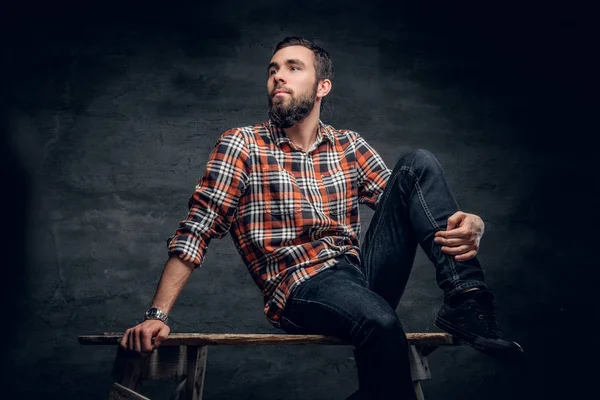 Man dressed in a jeans and a plaid shirt — Stock Photo, Image