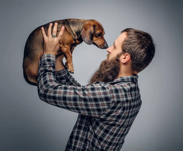 Urban man holding dog