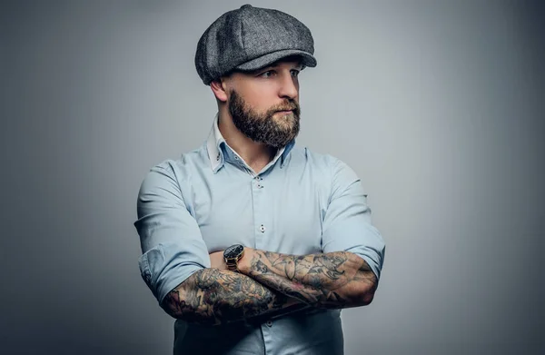Man in a white shirt and a tweed cap — Stock Photo, Image