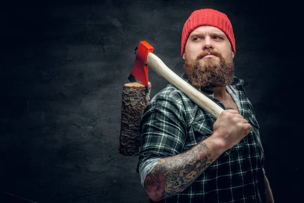 Lumberjack in a green shirt  holding axe — Stock Photo, Image