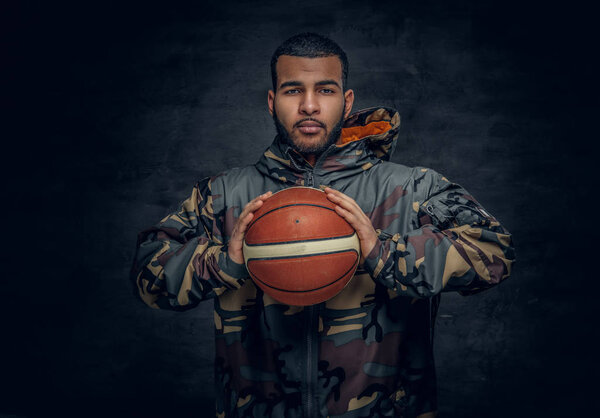 Black man in a camouflage hoodie