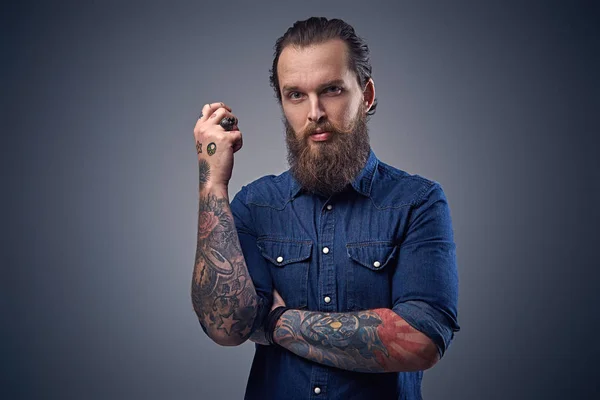 Bearded male with tattoos on arms — Stock Photo, Image