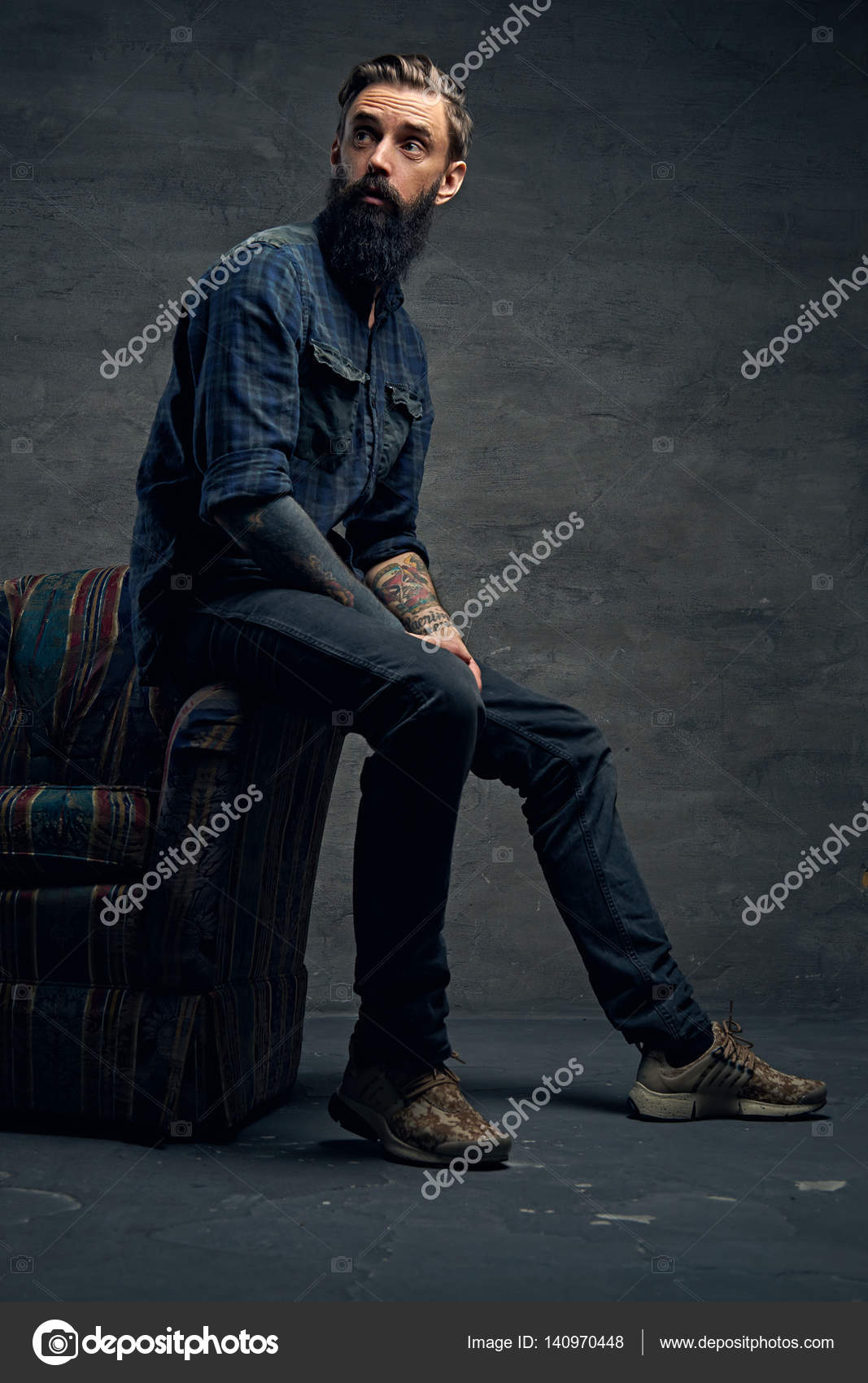 Bearded male sits on a chair Stock Photo by ©fxquadro 140970448