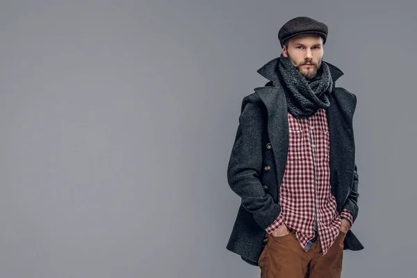 Man in a gray jacket and a wool cap — Stock Photo, Image