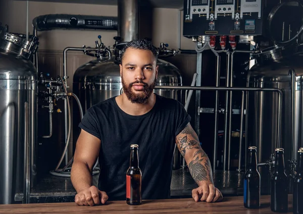 Black man presenting craft beer