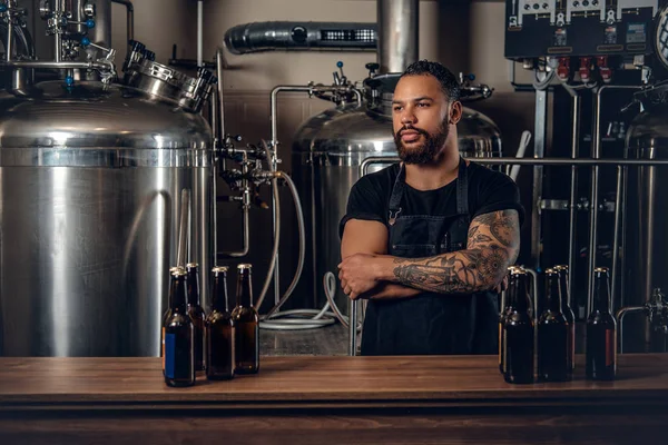 Black man presenting craft beer