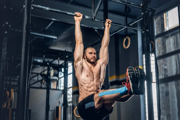 Sporty male doing ABS workout