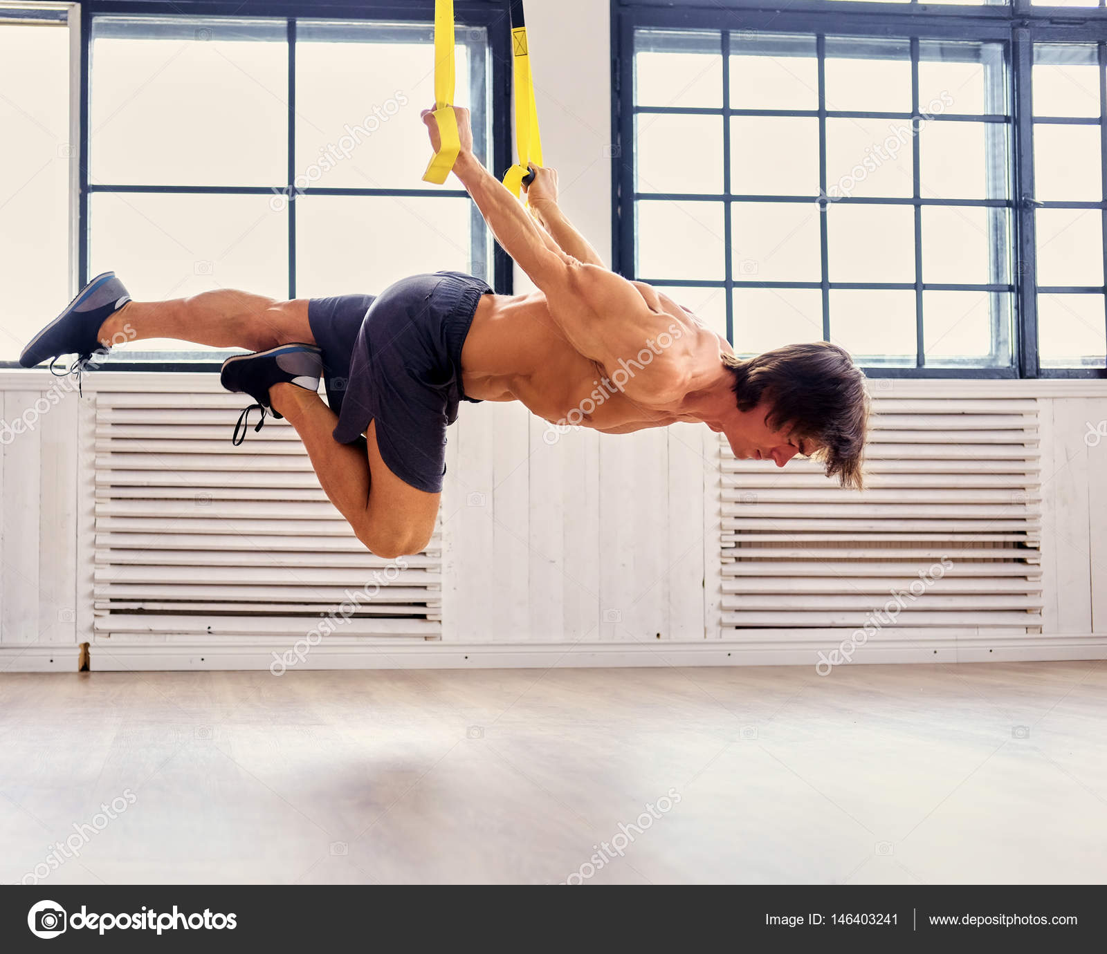 Man exercising with fitness trx straps — Stock Photo © fxquadro #146403241