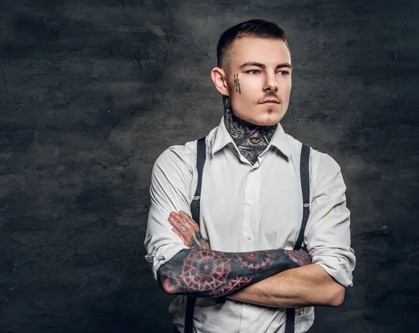 Man with a tattoos and crossed arms — Stock Photo, Image