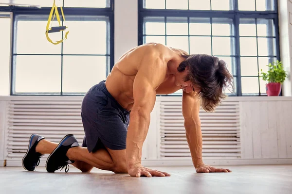 Man exercising with fitness trx straps