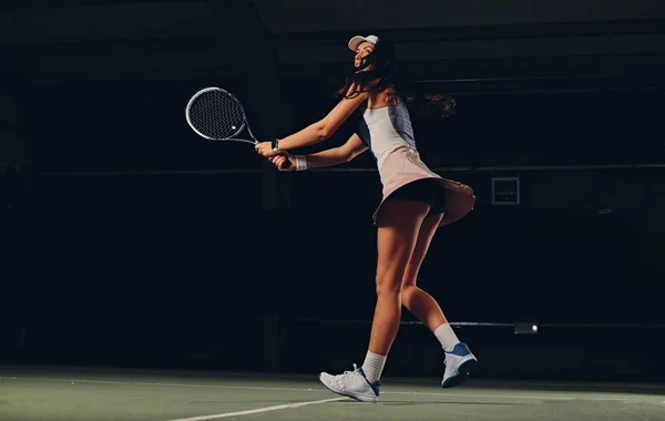 Female tennis player in action