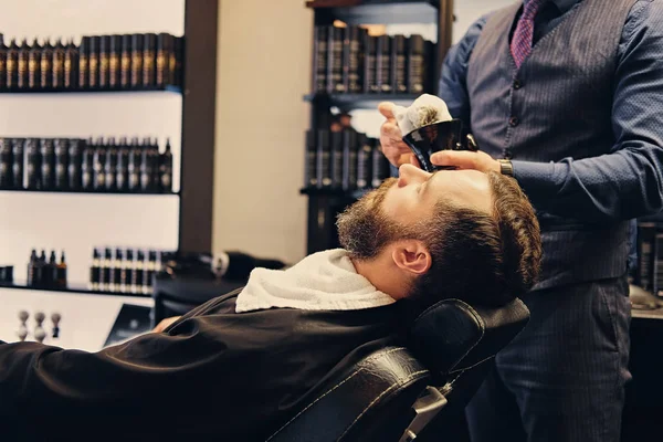 Barber applies shaving foam — Stock Photo, Image