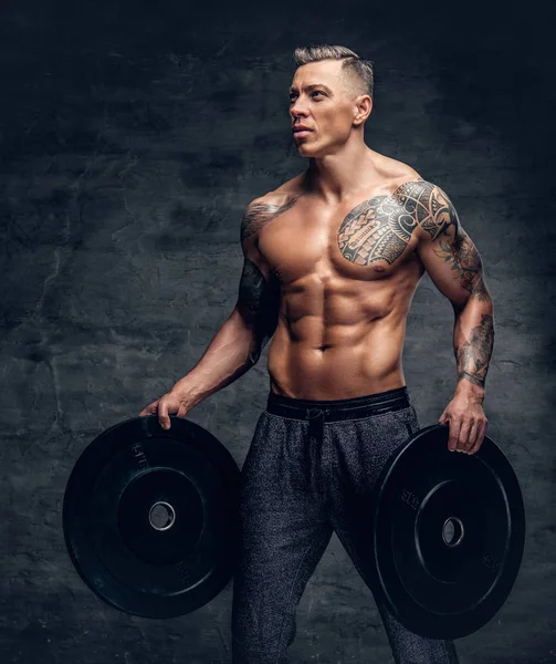 Shirtless male holds barbell weights — Stock Photo, Image