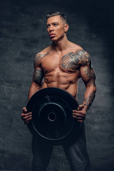 Shirtless male holds barbell weight — Stock Photo, Image