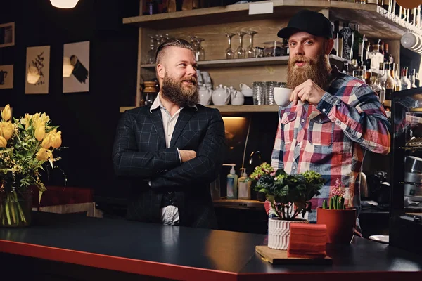 Two bearded men in coffee shop