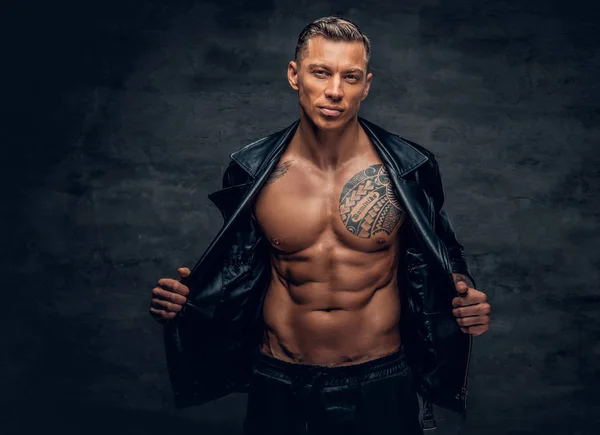 Handsome man with tattoo on a chest — Stock Photo, Image