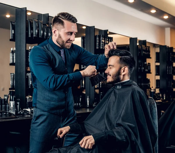 Stylish hairdresser doing haircut — Stock Photo, Image