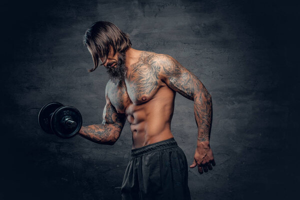 Shirtless man doing a biceps workout