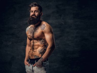 Shirtless bearded male with tattooed torso clipart