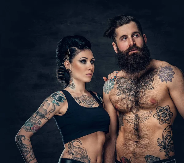 Tattooed bearded man and brunette woman — Stock Photo, Image