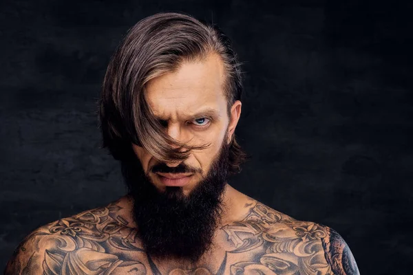 Portrait of tattooed shirtless bearded male. — Stock Photo, Image