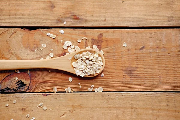 Kochlöffel mit Haferflocken — Stockfoto