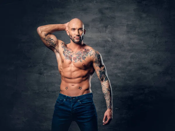 Muscular man with tattoos on torso — Stock Photo, Image