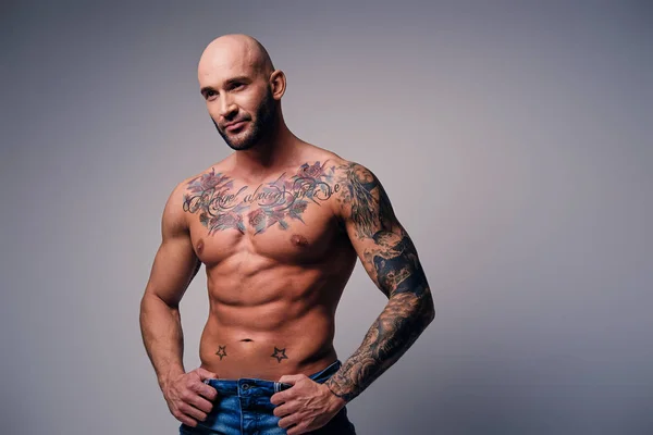 Muscular male with tattoos — Stock Photo, Image