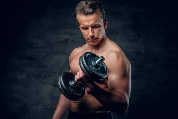 Man doing biceps exercise with dumbbell — Stock Photo, Image