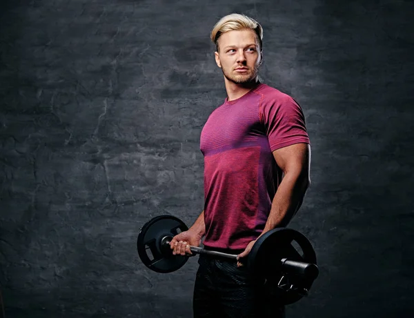 Athletic blond man doing a biceps workout