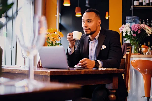 Man drinks coffee in a restaurant