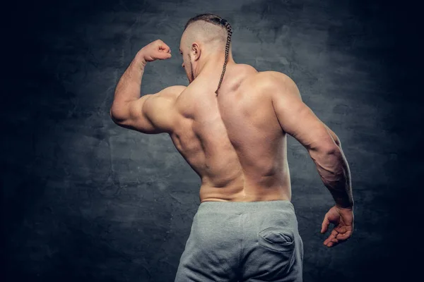 Shirtless bodybuilder from back — Stock Photo, Image