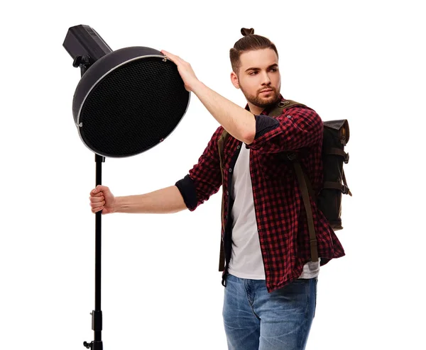 Casual man holds lighting equipment — Stock Photo, Image