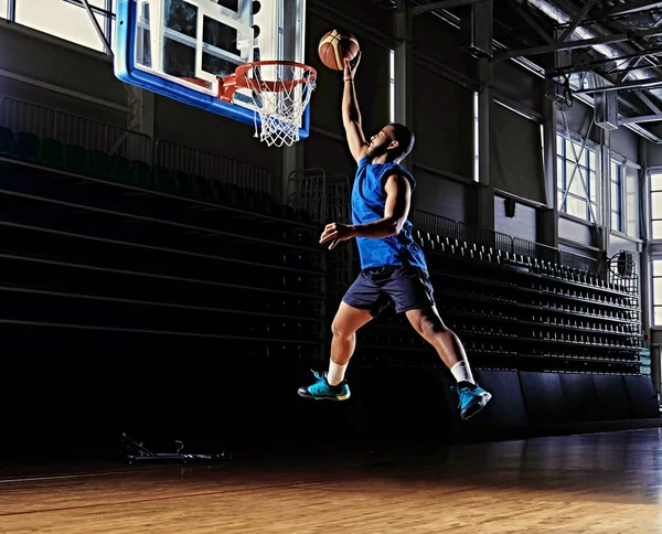 Basketball player in action on a basketball field