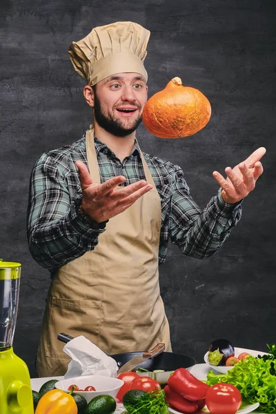 Chef cook holds pumpkin — Stock Photo, Image