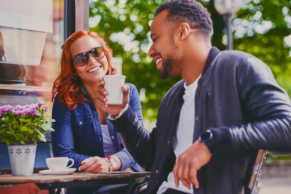 Black male and redhead female in a cafe — Stock Photo, Image