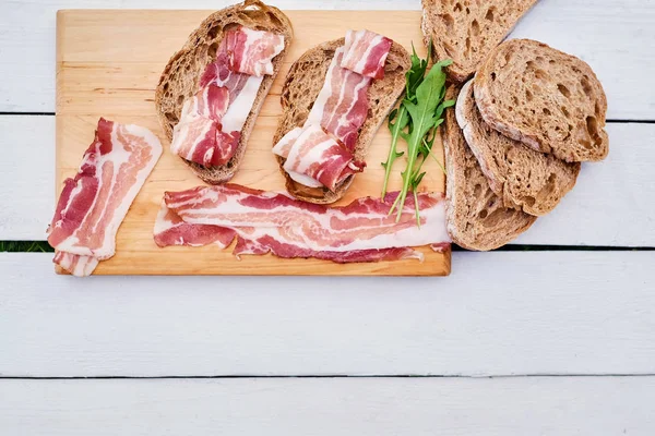 Bread with gourmet meat on desk — Stock Photo, Image