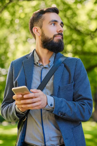 Stylish bearded man using smartphone — Stock Photo, Image