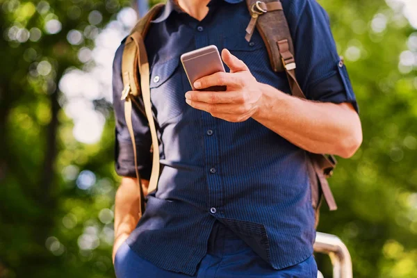 Man holds silver smart phone — Stock Photo, Image