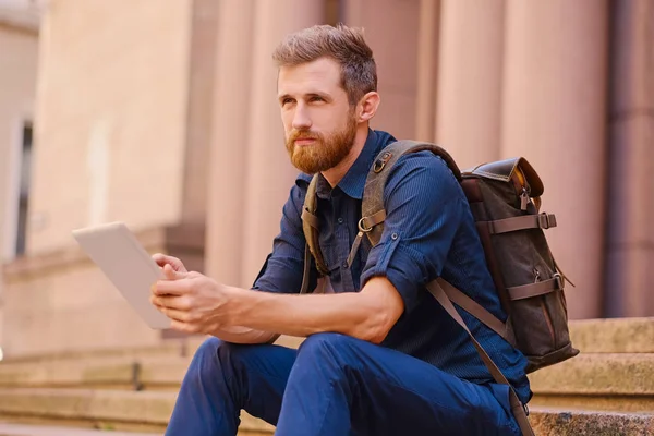 Casual man using a tablet pc — Stock Photo, Image