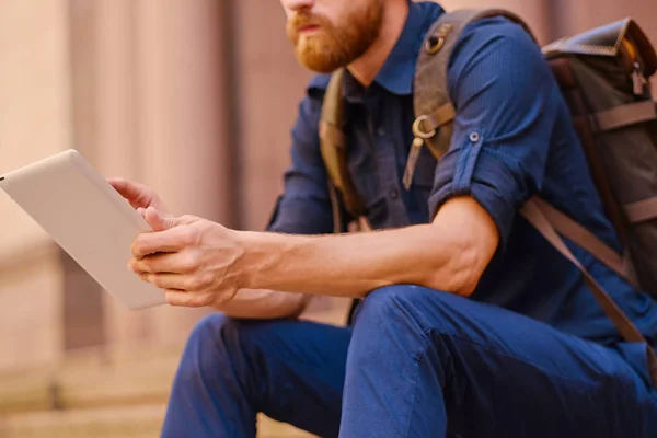 Casual man using a tablet pc — Stock Photo, Image