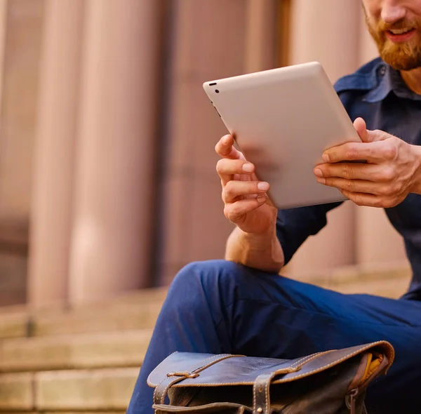 Casual man using a tablet pc — Stock Photo, Image