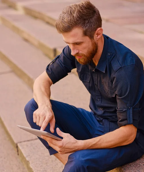 Bearded male using a tablet — Stock Photo, Image