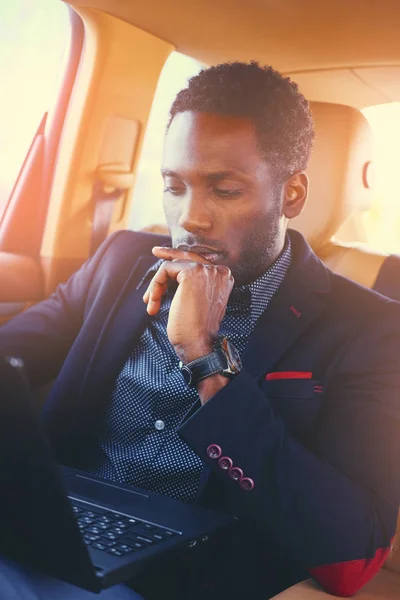 Stylish Black male using a laptop — Stock Photo, Image