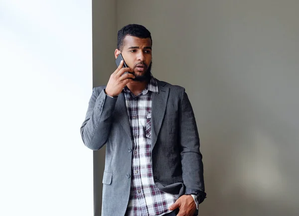Black man using a smart phone