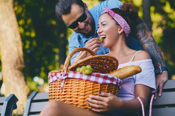 Tattooed bearded male and redhead female