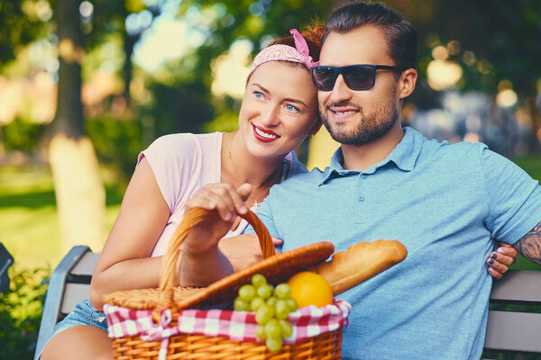 Tattooed bearded male and redhead female