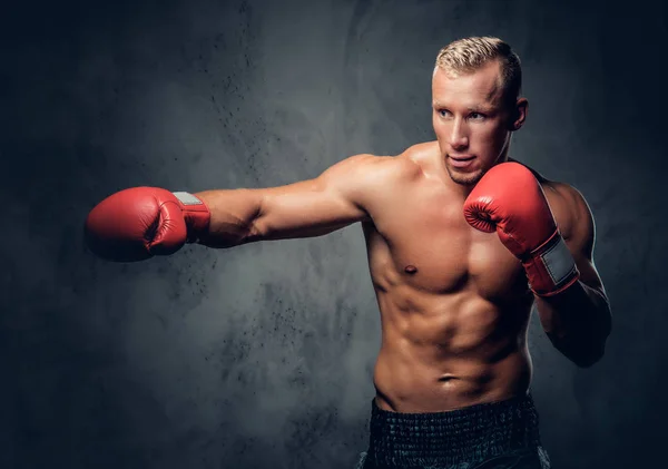 Shirtless kick boxer showing his punches — Stock Photo, Image