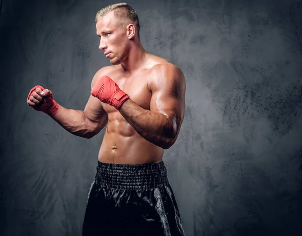 Kick boxer in red bandages — Stock Photo, Image