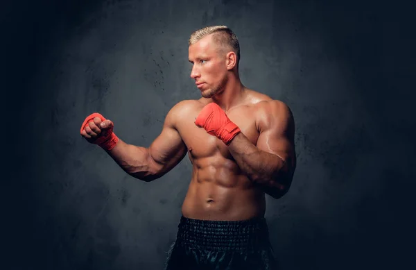 Kick boxer in red bandages — Stock Photo, Image